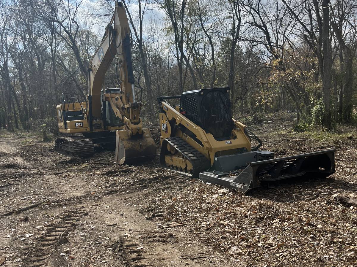 Caterpillar compact track loader running a forestry mulcher